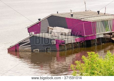 Sunken House In A River. Due To The Flood, The Building Went Under Water At Half The Height Of The W
