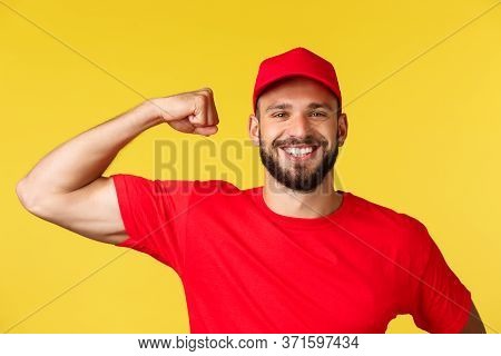 Close-up Of Confident And Cheerful Delivery Guy Showing How Storng He Is, Can Carry Huge Heavy Packa