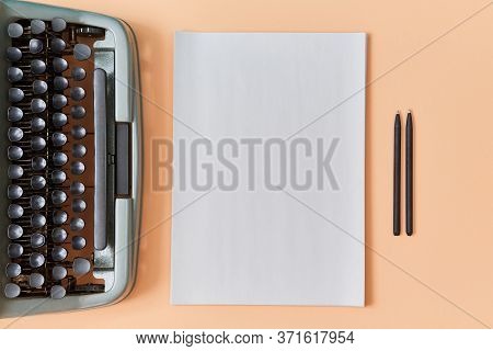 Writers Work. Authorship Concept. New Chapter. Top View Of Vintage Typewriter, Clear Sheet And Pens 