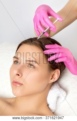 Cosmetologist Does Prp Therapy Against Hair Loss And Anti-dandruff Of A Beautiful Brunette Woman In 