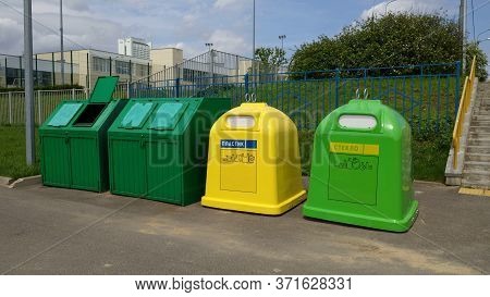Containers For Separate Garbage Collection.the Inscription On The Container:plastic,glass.