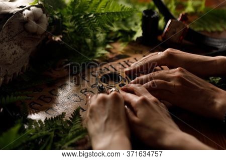 Mystic Ritual With Ouija And Candles. Devil's Board Concept, Black Magic Or Fortune Telling Rite Wit