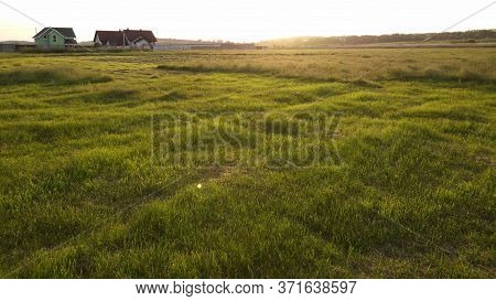 A Lonely House In The Middle Of A Green Field