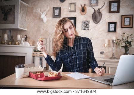 Busy Businesswoman Work At Home While Working On Table Desk With Laptop At The Same Time She Eating,