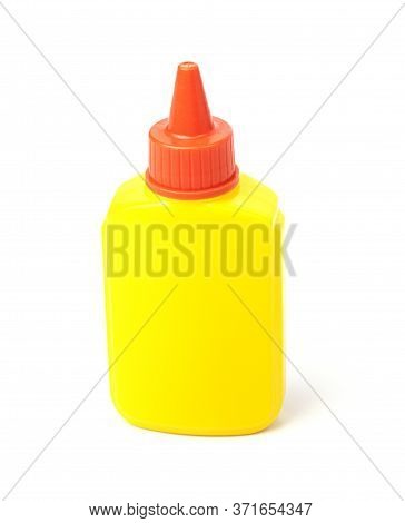 A Tube Of Yellow Stationery Glue For Paper Isolated On A White Background. School Supplies