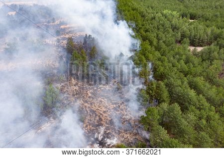 Aerial Drone View Of A Wildfire In Forested Area.