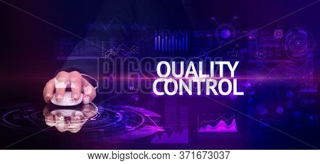 hand holding wireless peripheral with QUALITY CONTROL inscription, modern technology concept