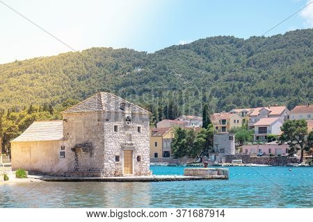 Small Picturesque House Of Saint Jerolim, Stone Greek Style Building Standing On The Waterfront Of S