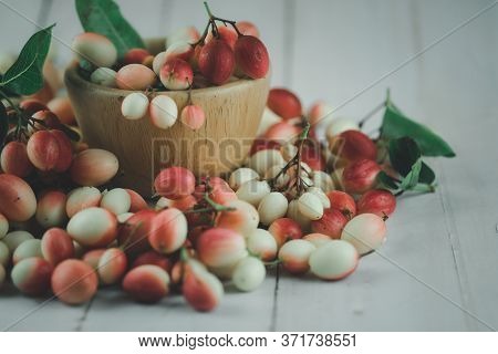 Karanda Plum Or Koromcha Fruits In Wooden Cup