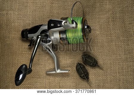 Fishing, Carp Reel With Fishing Linel On The Background Of Burlap . Burlap Background.