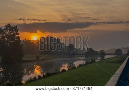 Fog And River Dyje With Orange Sunrise Near Bulhary Village In South Moravia