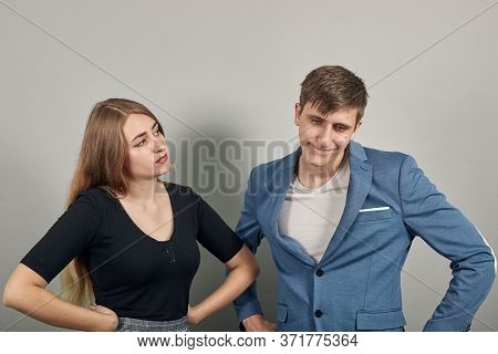 Standing, Holding Hands On Waist Displeased At Some Rude Behavior. Irritation, Misunderstanding, Loo