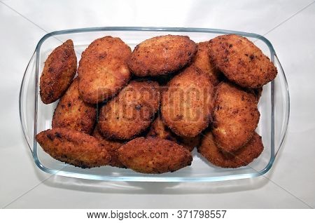 Liver Cutlets On A Light Plate. Close Up . Homemade Cutlets On A White Plate And White Background . 