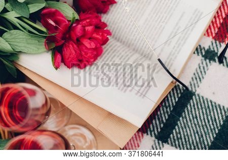Mood Reading A Picnic Book Under A Glass Of Red Wine
