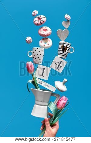 St. Valentines Day Fun Background In Blue Mint . Date 14 February On Wooden Calendar With Coffee Cup