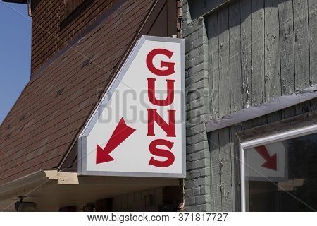 Gun Store Sign. Gun Sales Tend To Rise As Safety Concerns Spread.