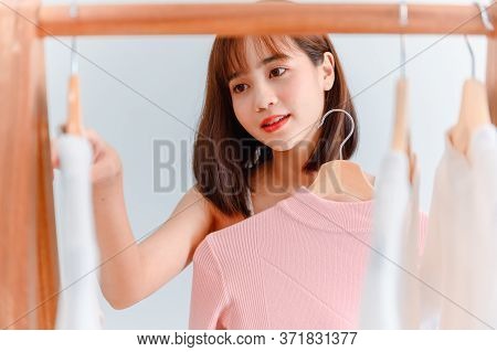 Asian Woman Dress-up At Home. Lifestyle In The Bedroom. Social Distancing And Self-quarantine.