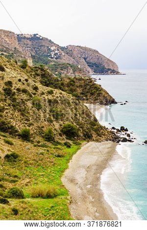 Tower On Spanish Coast, Seaside Cliffs Of Maro Cerro Gordo. Costa Del Sol, Andalusia Spain.