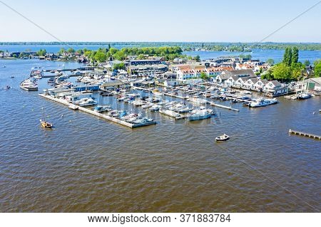 Aerial from the harbor at the Loosdrechtse Plassen in the Netherlands on a beautiful summer day
