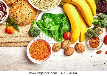 Selection Food Rich In Fiber On White Wooden Background.