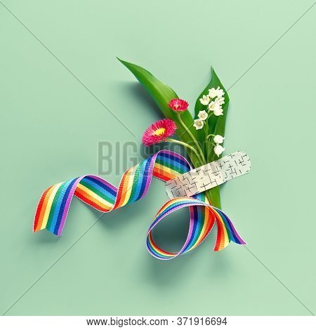 Thank You Doctors And Nurses Rainbow Ribbon And Bouquet Of Red Primrose And Lily Of The Valley Flowe