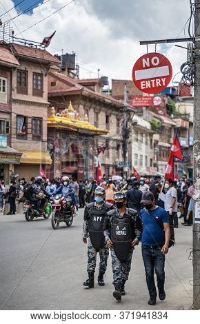 June 14, 2020, Kathmandu, Nepal. Afp Special Forces Police Are Walking Under Road Sign 