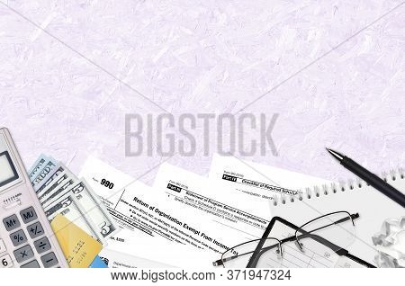 Irs Form 990 Return Of Organization Exempt From Income Tax Lies On Flat Lay Office Table And Ready T