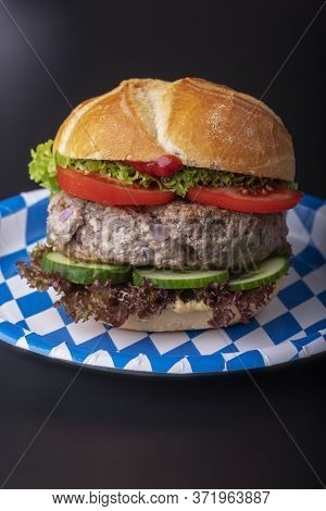 Bavarian Burger In A Typical Bun On Black