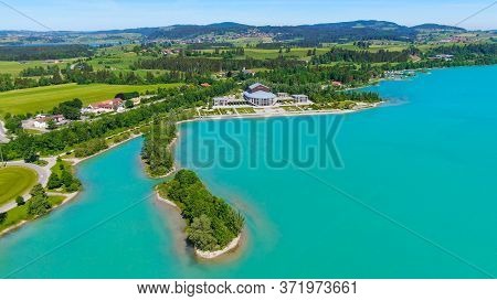 Aerial View Over Lake Forggensee At The City Of Fuessen In Bavaria Germany