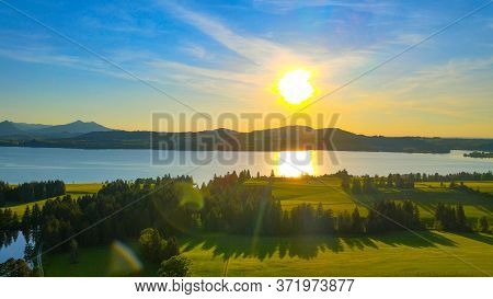 Aerial View Over Lake Forggensee At The City Of Fuessen In Bavaria Germany