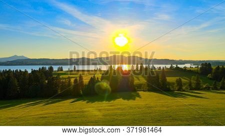 Aerial View Over Lake Forggensee At The City Of Fuessen In Bavaria Germany