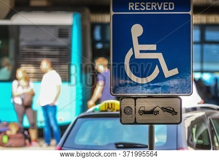 Bucharest, Romania - July 15, 2019: A Reserved Handicapped Parking Sign (reserved Disabled Parking S