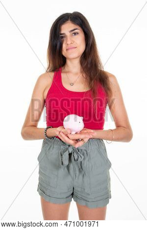 Young Caucasian Woman Holding Pink Small Piggy Bank On White Background