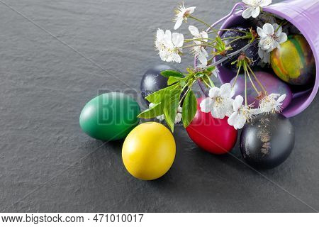 Chicken Bucket  With Painted Easter Eggs On Dark Tabletop. Concept Creative Banner. Holiday Greeting