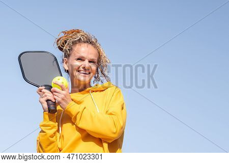 Portrait Woman Player Pickleball Game Over Blue Sky, Pickleball Yellow Ball With Paddle, Outdoor Spo