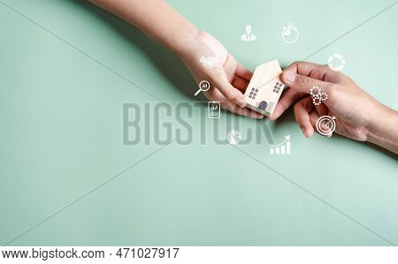 Hands Holding Wooden House, Home Buyers Are Taking Home From Sellers, Dealer, Agent, Rent House Conc
