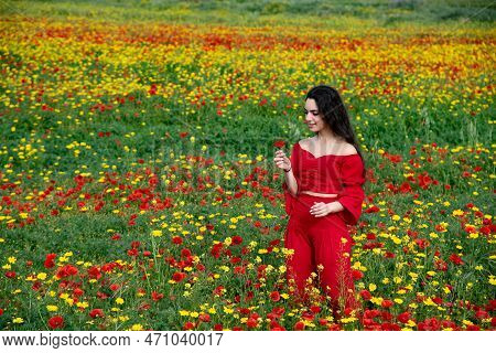 Beautiful Young Woman Smiling In The Poppy Flower Spring Field. Blooming Spring Time Season , Cyprus