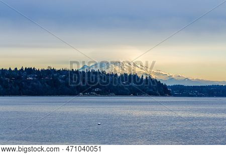 Clouds Cover Mount Rainier Across The Puget Soud In Washington State.
