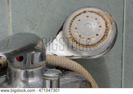 Shower Limescale. Dirty Shower Head With Limescale And Rust. Selective Focus, Shallow Depth Of Field