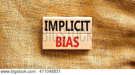 Implicit Bias Symbol. Concept Words Implicit Bias On Wooden Block. Beautiful Canvas Table Canvas Bac