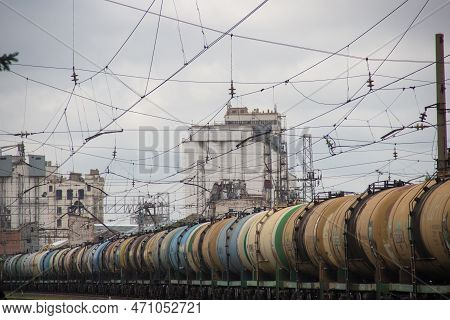 A Row Of Train Cars Sitting On A Train Track.a Huge Number Of Wagons With Oil Products, Wires In The