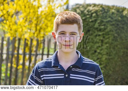 Young Red Haired Boy Looking Confident And Happy