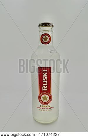 A Closeup Of A Ruski Vodka And Lemon On A White Background
