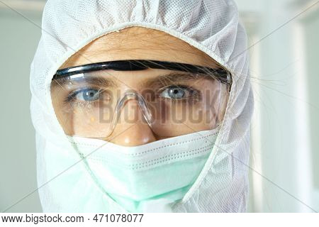 Doctor Wore A Protective Gown From The Coronavirus And He Raised His Hand To Stop.medical Concepts