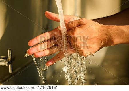 Hands Of Woman Wash Their Hands In A Sink With Foam To Wash The Skin And Water Flows Through The Han