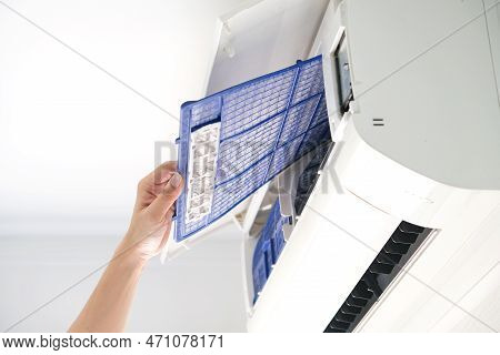 Male Repair Air Conditioner At Room, He Is Air Technician , Mechanic , Engineer. Maintenance Air Con