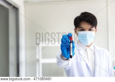 Scientist Man Holding Sample Blood Test Tube In Science Laboratory. Doctor Clinic Healthcare Technic