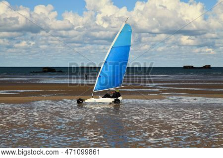 Arromanches, France - October 14 2012: Land Sailing On Gold Beach In Normandy. In The Background, We