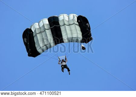 Kuala Lumpur, Malaysia - August 24 2007: A Man In Mid Air After Base Jumping From The Kuala Lumpur T