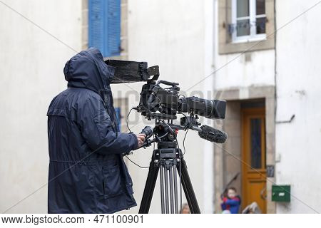 Douarnenez, France - February 27 2022: Cameraman Filming For A Local Tv Channel During Les Gras De D